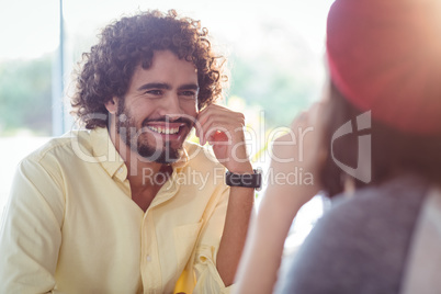 Couple interacting with each other in cafe