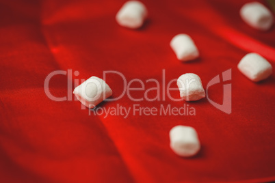 Sweet marshmallow on red cloth