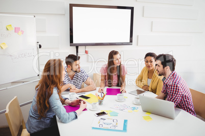 Business people interacting in meeting at creative office