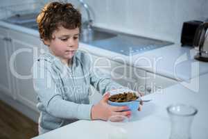 Boy having breakfast in the kitchen