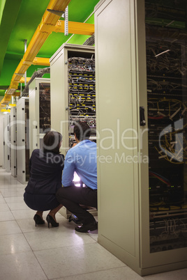 Technicians analyzing server