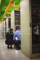 Technicians analyzing server