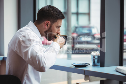 Businessman having a cup of coffee