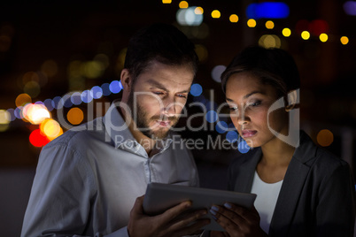 Businesspeople using digital tablet