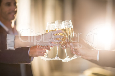 Group of businesspeople toasting glasses of champagne