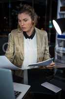 Businesswoman looking at documents
