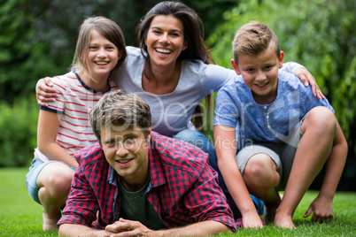 Happy family smiling in park