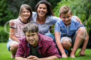 Happy family smiling in park