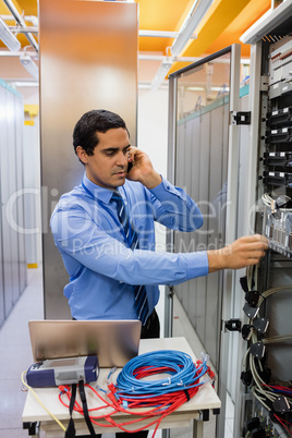 Technician talking on mobile phone