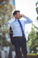 Handsome businessman talking on mobile phone