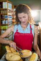 Female staff working at bakery store