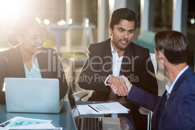 Businessman shaking hands with a colleague