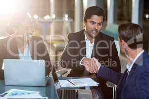 Businessman shaking hands with a colleague