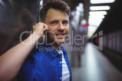 Portrait of handsome man talking on mobile phone