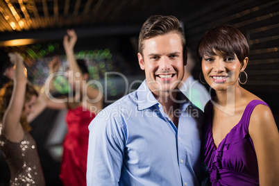 Cute couple standing together in bar