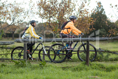 Biker couple cycling in countryside