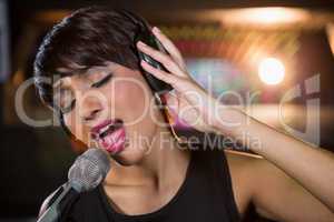 Woman singing in bar