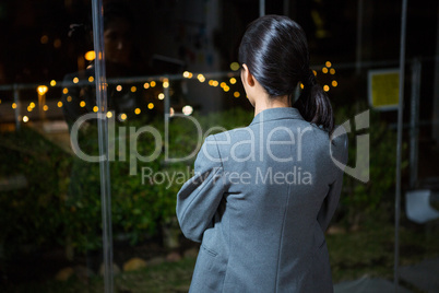Businesswoman looking out of window