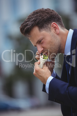 Handsome businessman talking on mobile phone