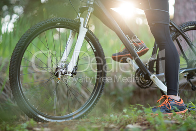 Low section of male biker with mountain bike