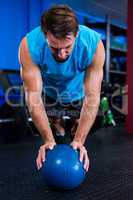 Male athlete with ball in gym