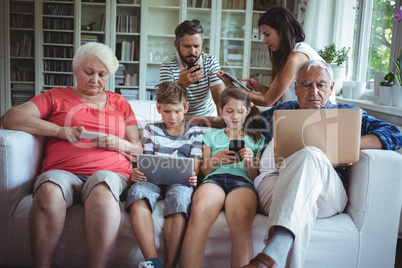 Multi-generation family using laptop, mobile phone and digital tablet