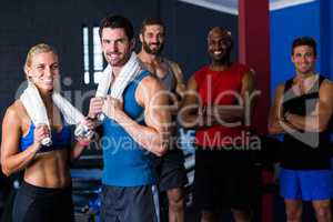 Portrait of happy multi-ethnic friends in gym