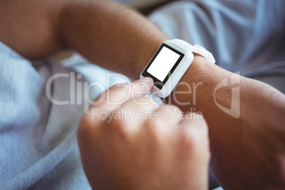 Father using a smart watch