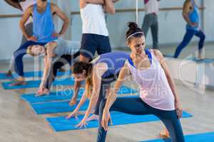 Group of people performing stretching exercise