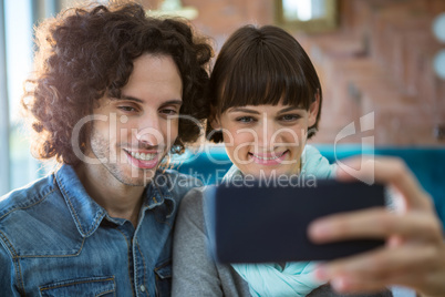 Couple taking selfie on mobile phone