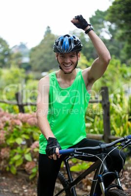 Male cyclist with mountain bike in park