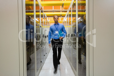 Technician walking in server room