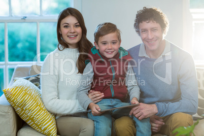 Happy family using digital tablet