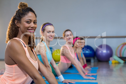 Group of women performing yoga