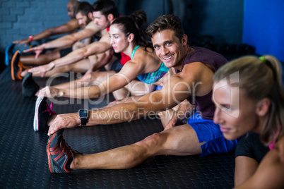 Young athlete friends stretching