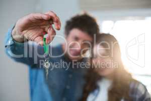 Couple holding the key of new home