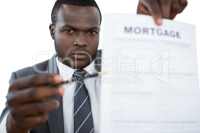 Businessman showing mortgage document