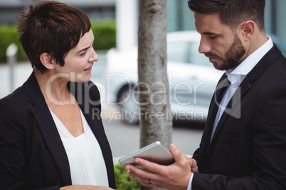 Businesspeople discussion on digital tablet