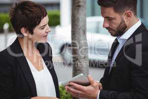 Businesspeople discussion on digital tablet