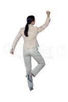 Businesswoman performing exercise against white background