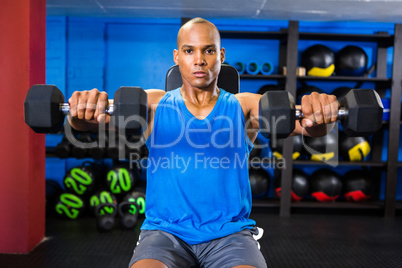 Male athlete exercising in fitness studio