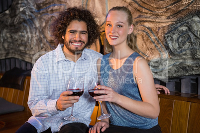 Couple sitting together and having glass of wine