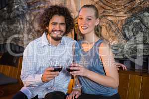 Couple sitting together and having glass of wine