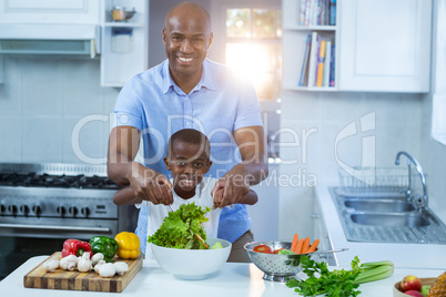 Father and son preparing food