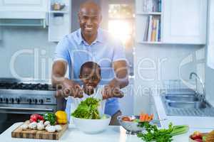 Father and son preparing food