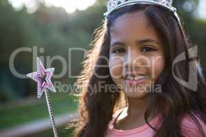 Portrait of girl in tiara and wand