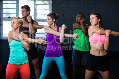 Athletes exercising in fitness studio Athletes exercising in fitness studio