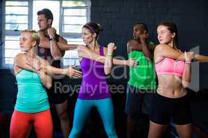 Athletes exercising in fitness studio