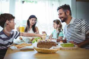 Happy family having breakfast