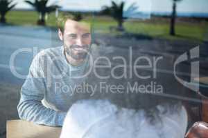 Man talking to a woman in coffee shop